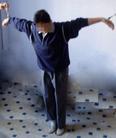 Published on 10/14/2004 哈尔滨万家劳教所迫害法轮功学员酷刑---8、双臂扣在两个床上（上床），四个人分别往两边拽床，将人抻起，抻得惨叫，五脏六腑抻碎一样痛，为防止喊出声，用胶带封嘴后，反复抻