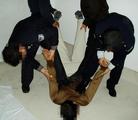 Published on 12/20/2004 		酷刑图：哈尔滨市长林子劳教所的酷刑
