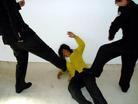 Published on 2/17/2005 		黑龙江省依兰县恶警酷刑折磨法轮功学员演示（图）
