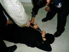 Published on 2/17/2005 		黑龙江省依兰县恶警酷刑折磨法轮功学员演示（图）
