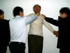 Published on 2/17/2005 		黑龙江省依兰县恶警酷刑折磨法轮功学员演示（图）
