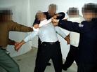Published on 2/17/2005 		黑龙江省依兰县恶警酷刑折磨法轮功学员演示（图）
