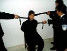 Published on 3/20/2005 		黑龙江哈尔滨市万家劳教所迫害大法弟子酷刑演示（图）
