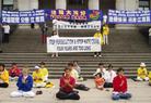 在温哥华举行的“揭露邪恶　结束迫害”的活动中学员集体炼功发正念  加拿大 2003-7