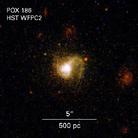 天文学家称宇宙在不断诞生出小型新生银河系,图为POX186的微小银河系由大约1000万颗恒星组成